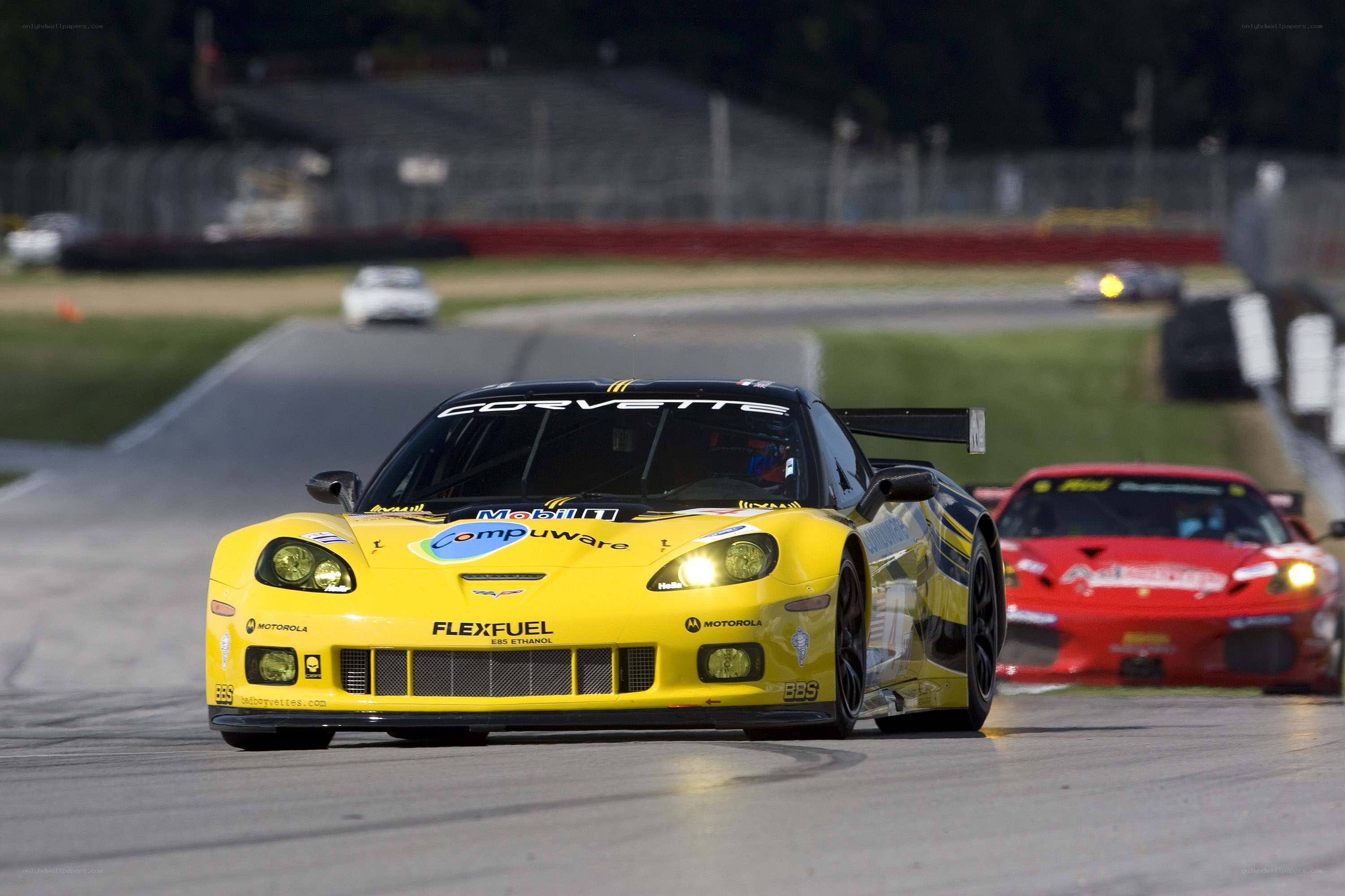 Yellow Corvette racing on track