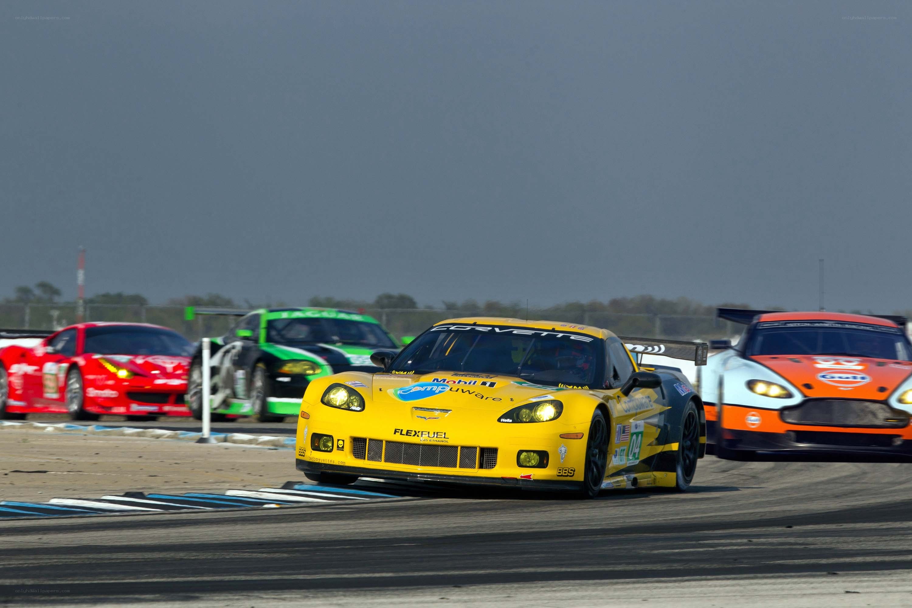 Yellow Corvette racing on track