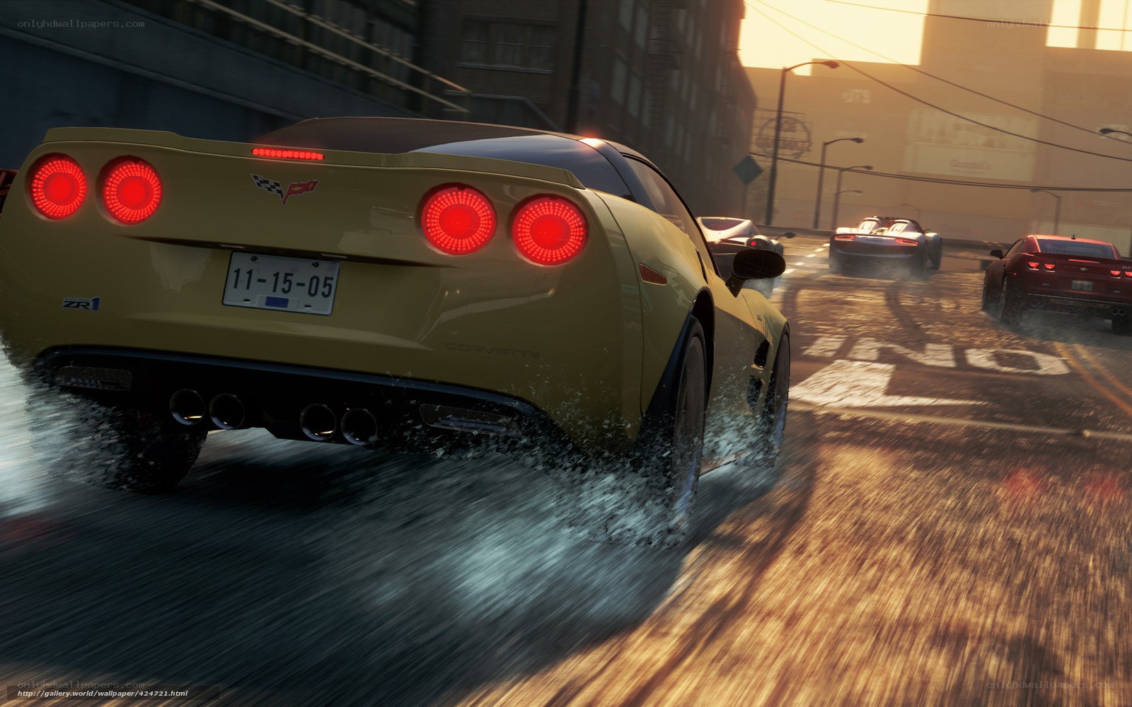 Yellow Corvette racing on wet street