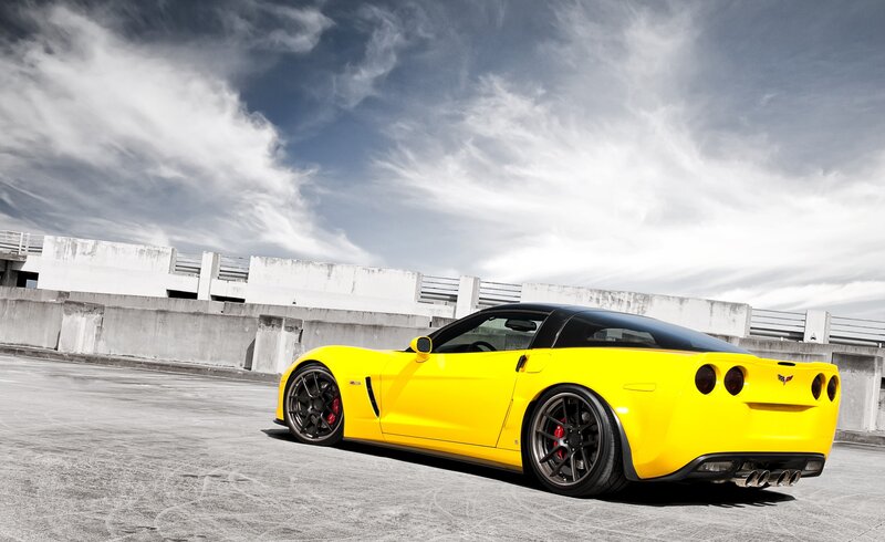 Yellow Corvette Sports Car — Dramatic, Afternoon, Photograph, Concrete Parking Lot