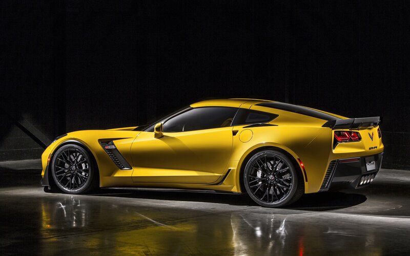 Yellow Corvette Sports Car — Dramatic, Photograph, Black Wheels, Rear Spoiler, Dark Interior