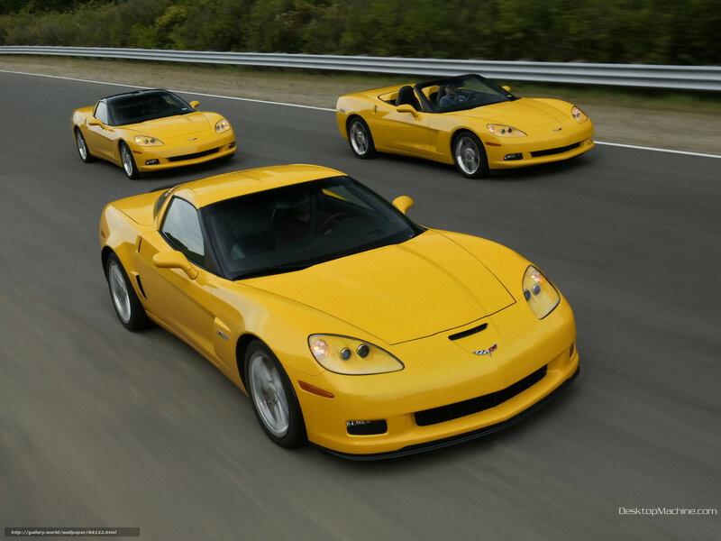 Yellow corvette sports cars on track