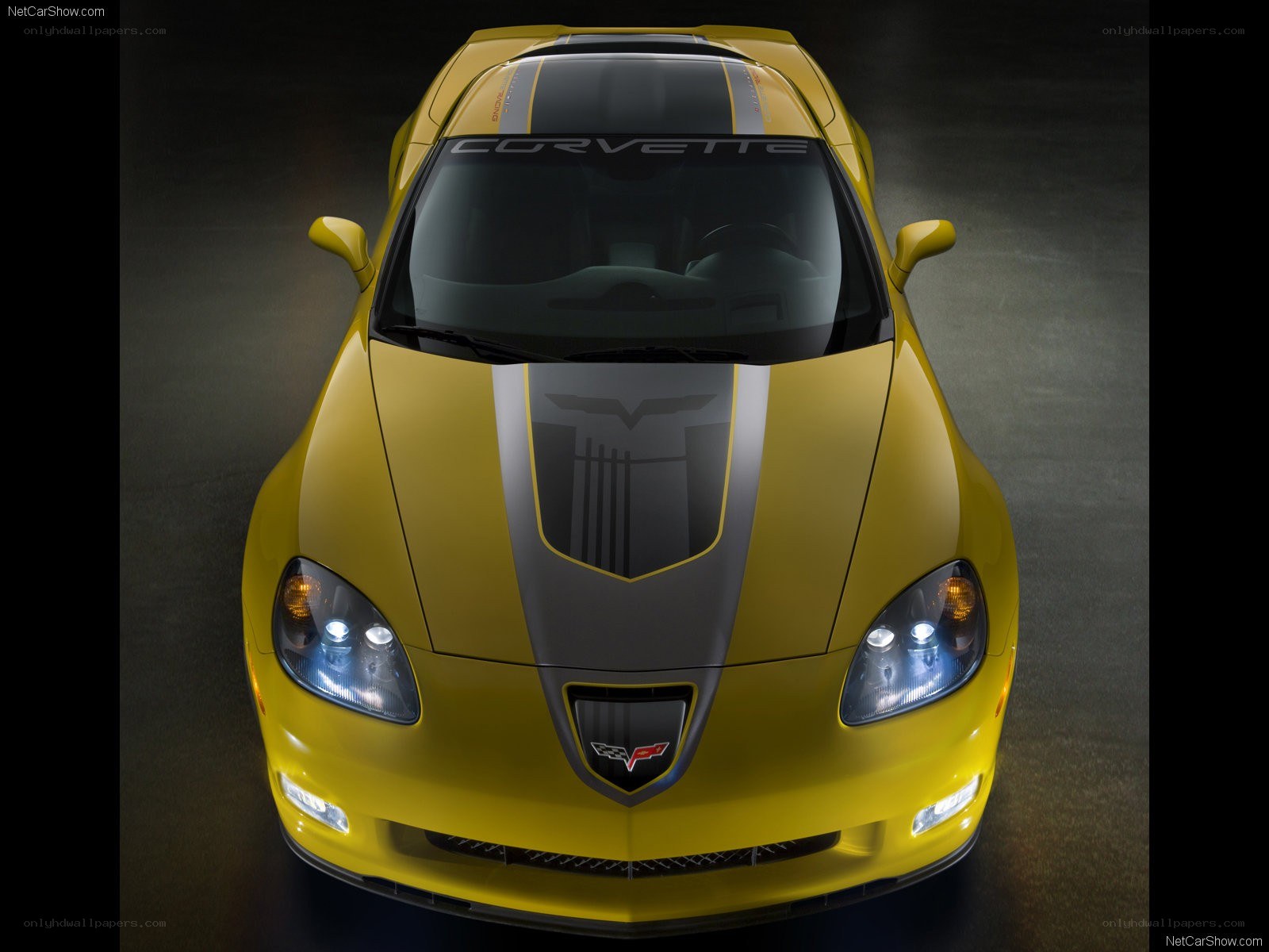 Yellow Corvette with racing stripes