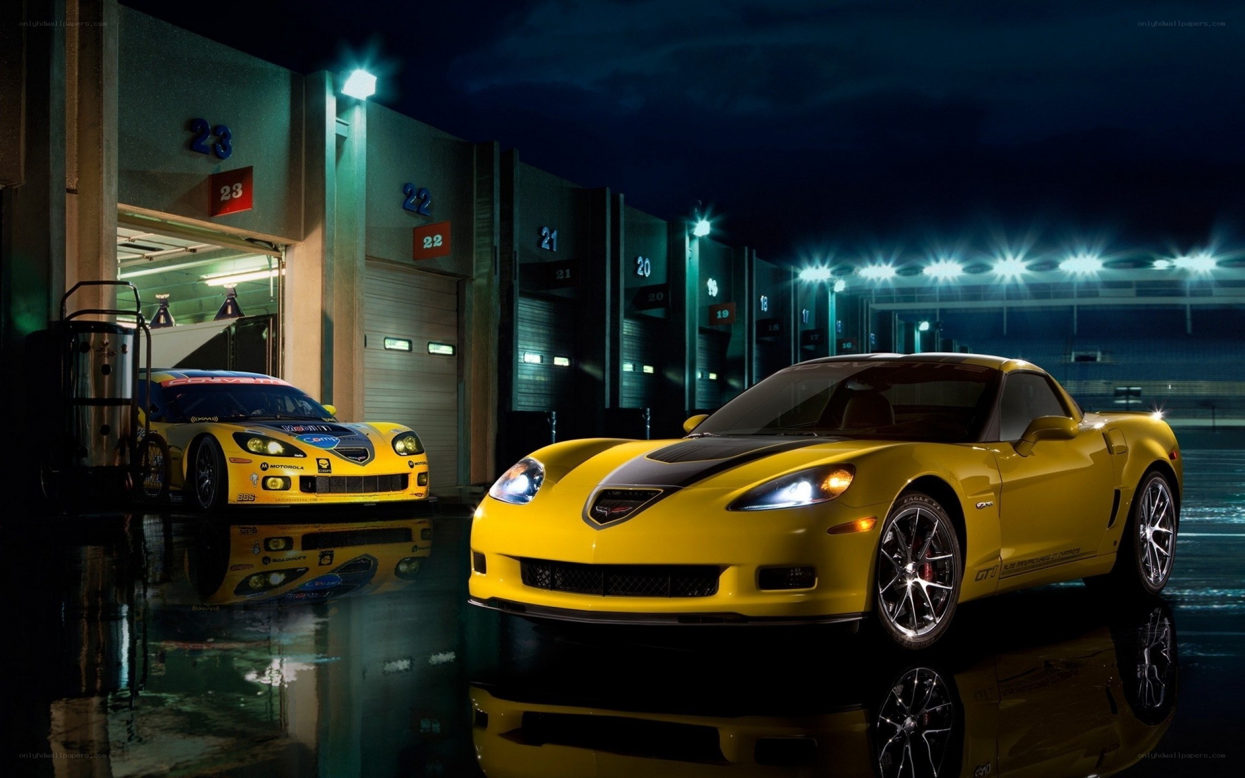 Yellow Corvettes at a racetrack