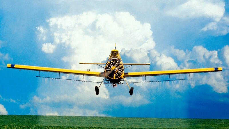 Yellow crop duster airplane