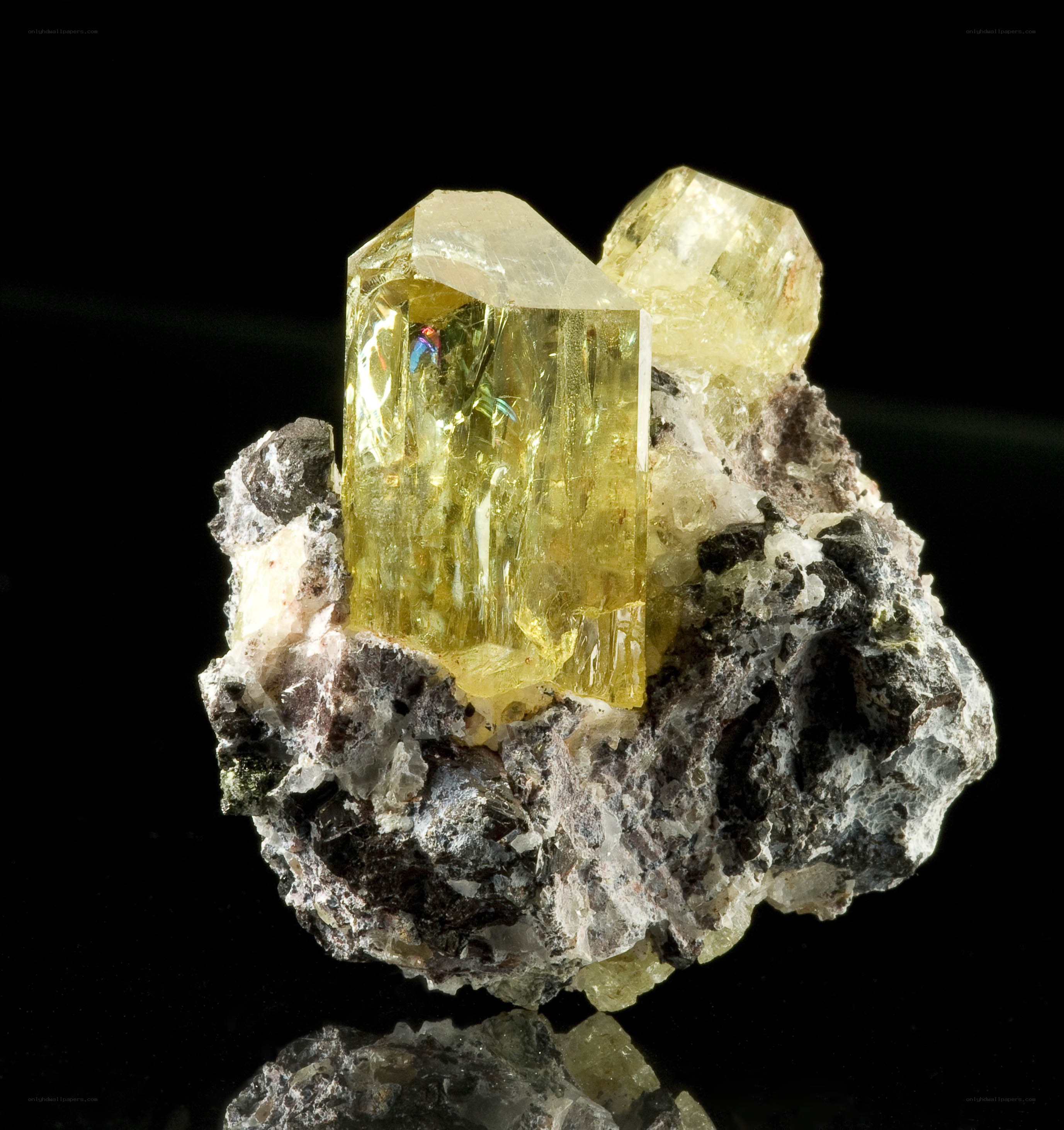 Yellow crystal on rock matrix