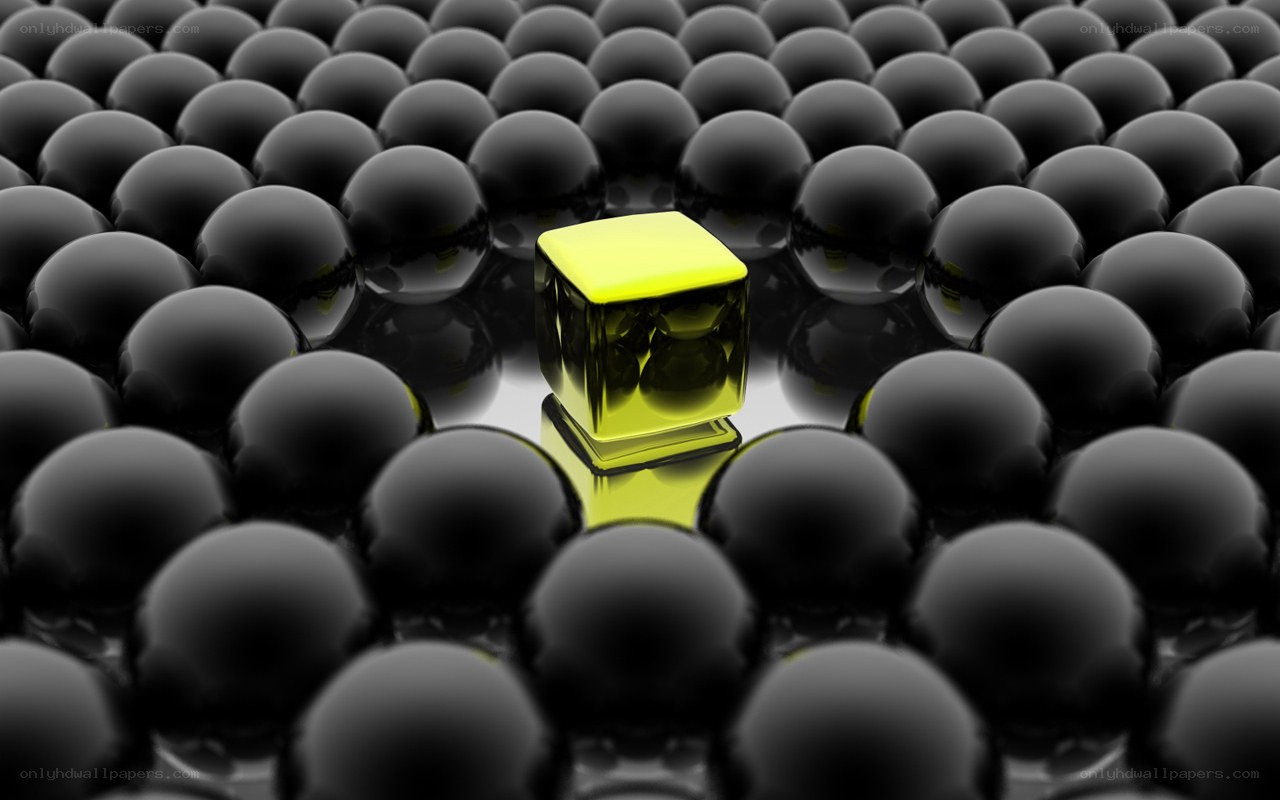 yellow cube among black spheres