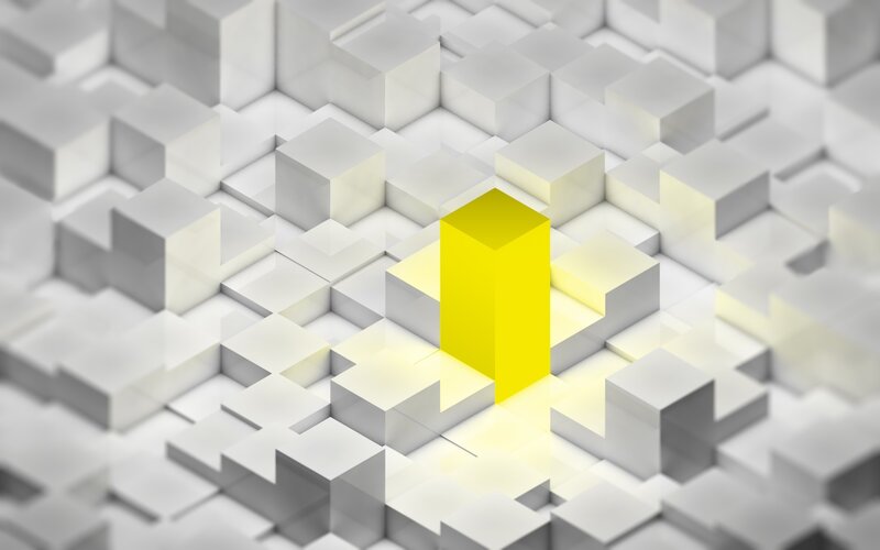 yellow cube on white grid