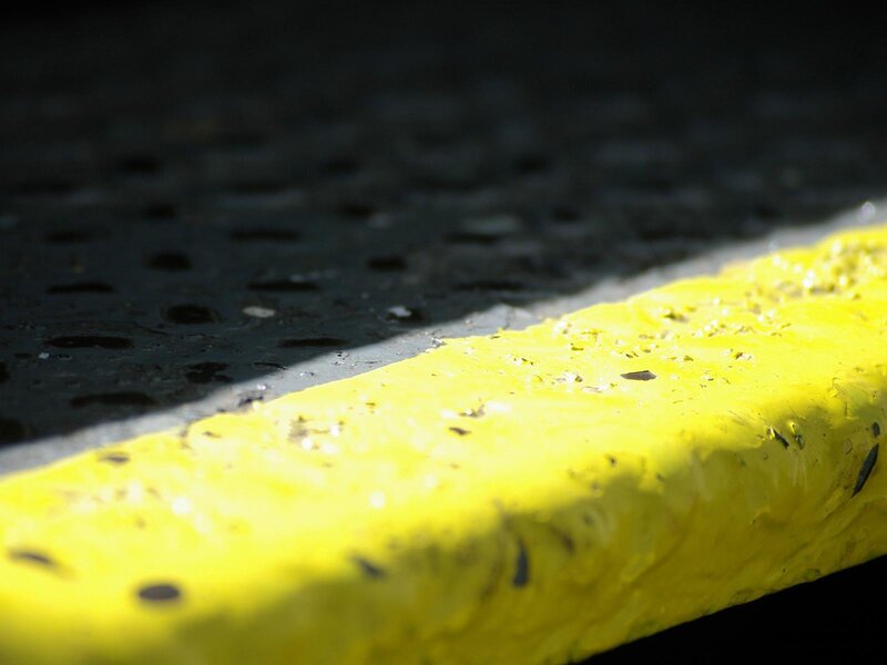 yellow curb in sunlight