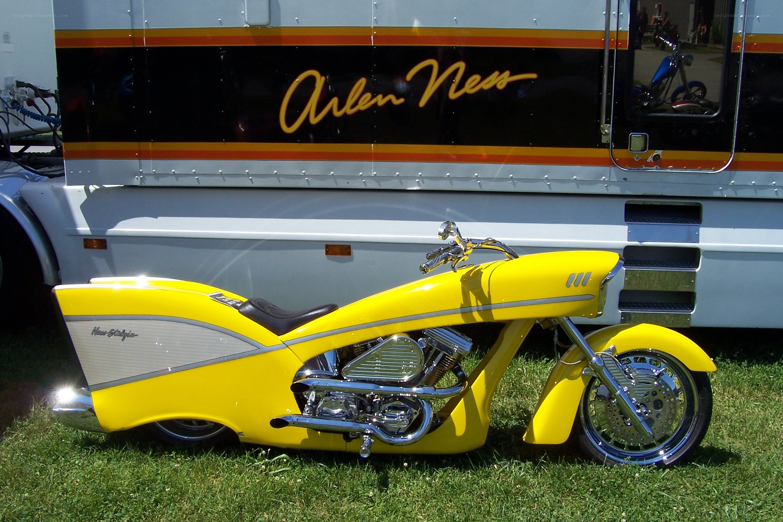 Yellow custom motorcycle on grass