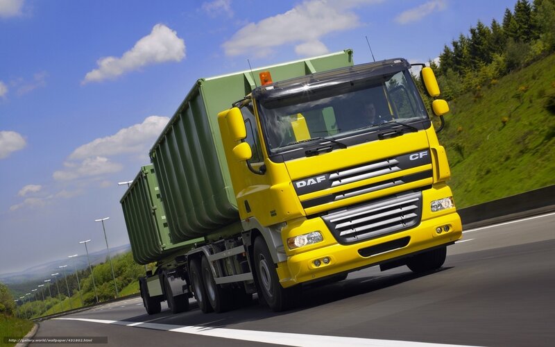 Yellow DAF truck on highway