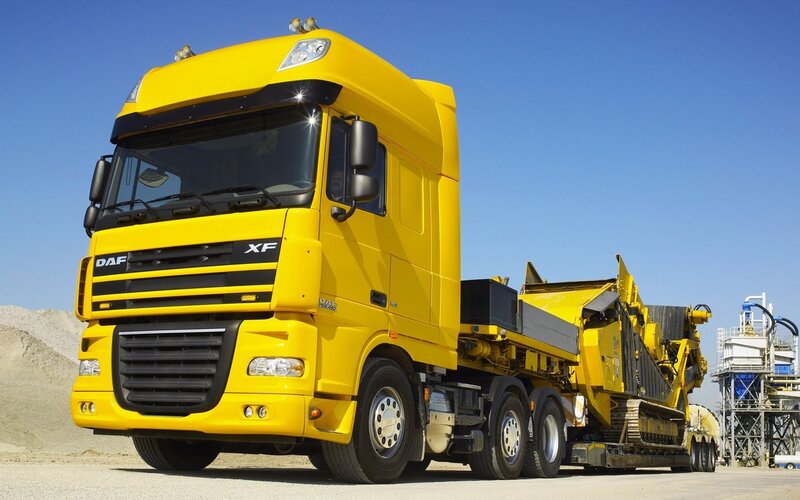 Yellow DAF XF truck with equipment