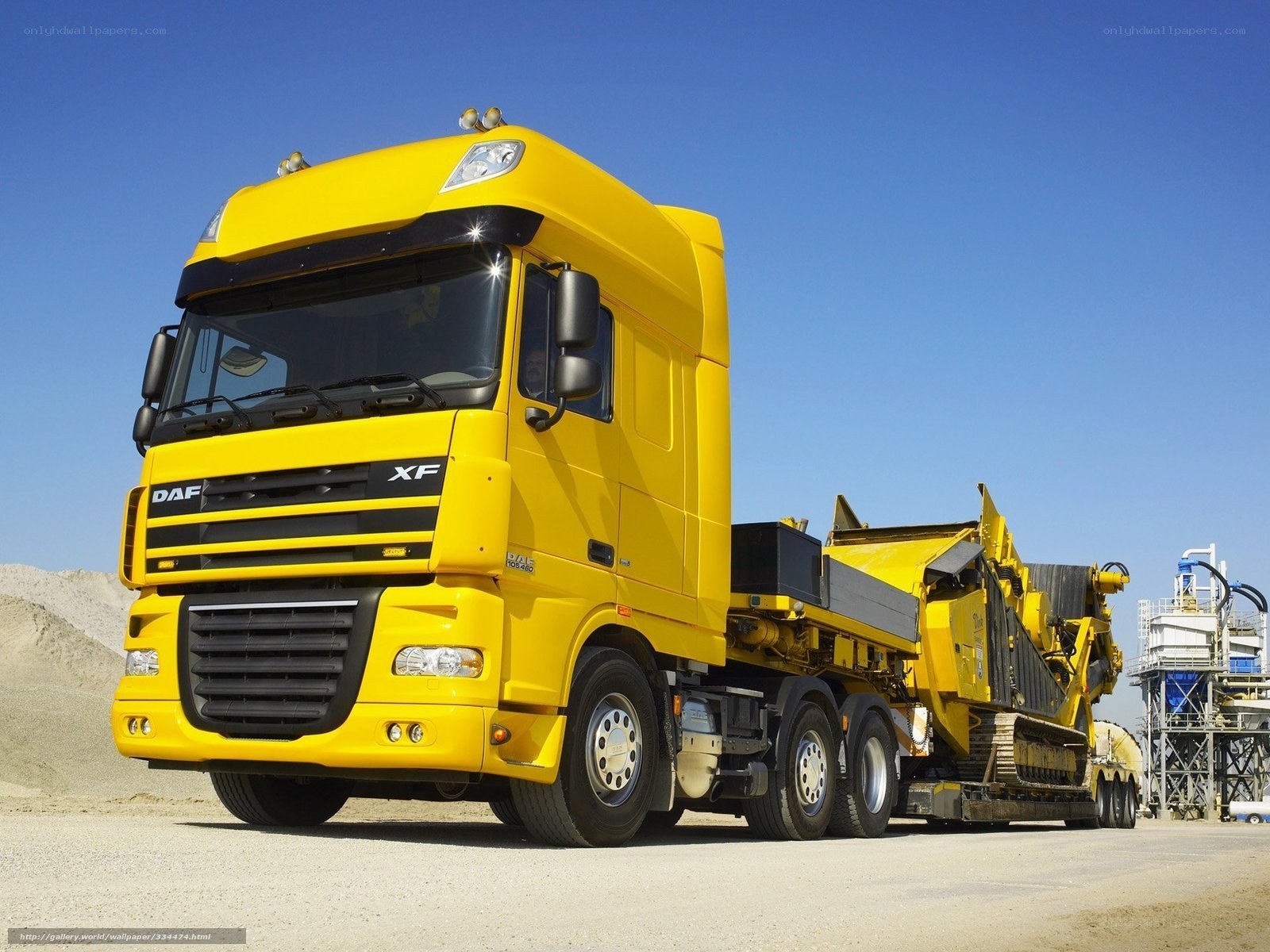 Yellow DAF XF truck with machinery