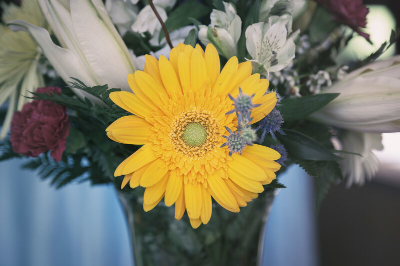 Yellow daisy in a flower arrangement