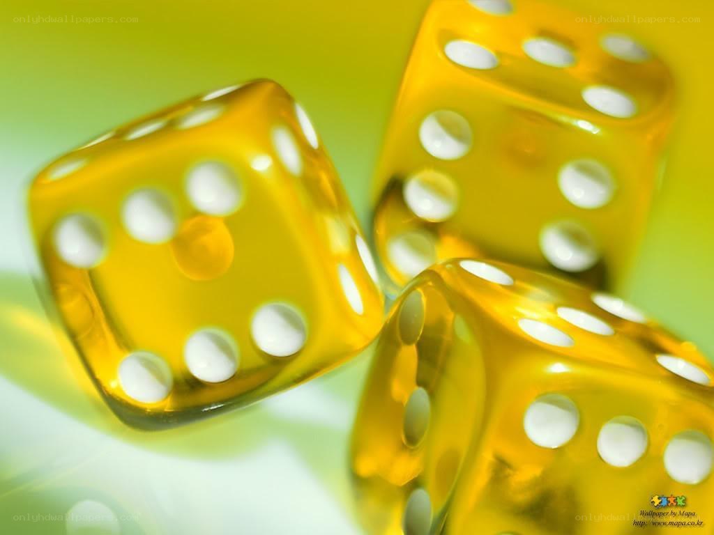 Yellow dice on green background