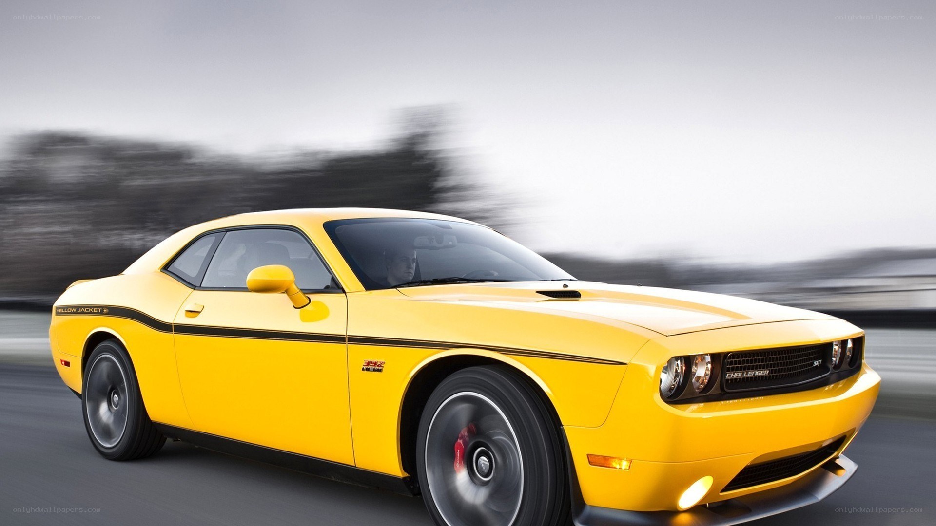 Yellow Dodge Challenger in motion