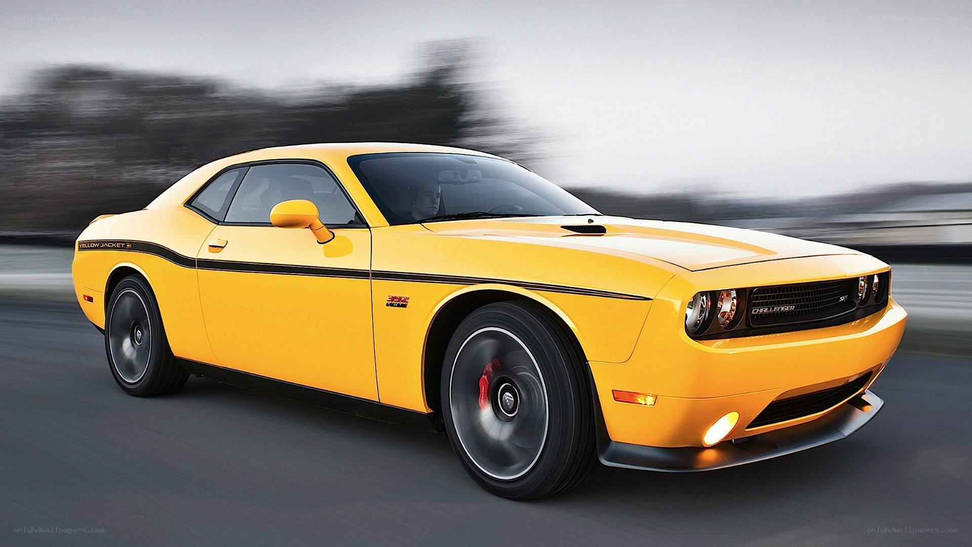 Yellow Dodge Challenger in motion