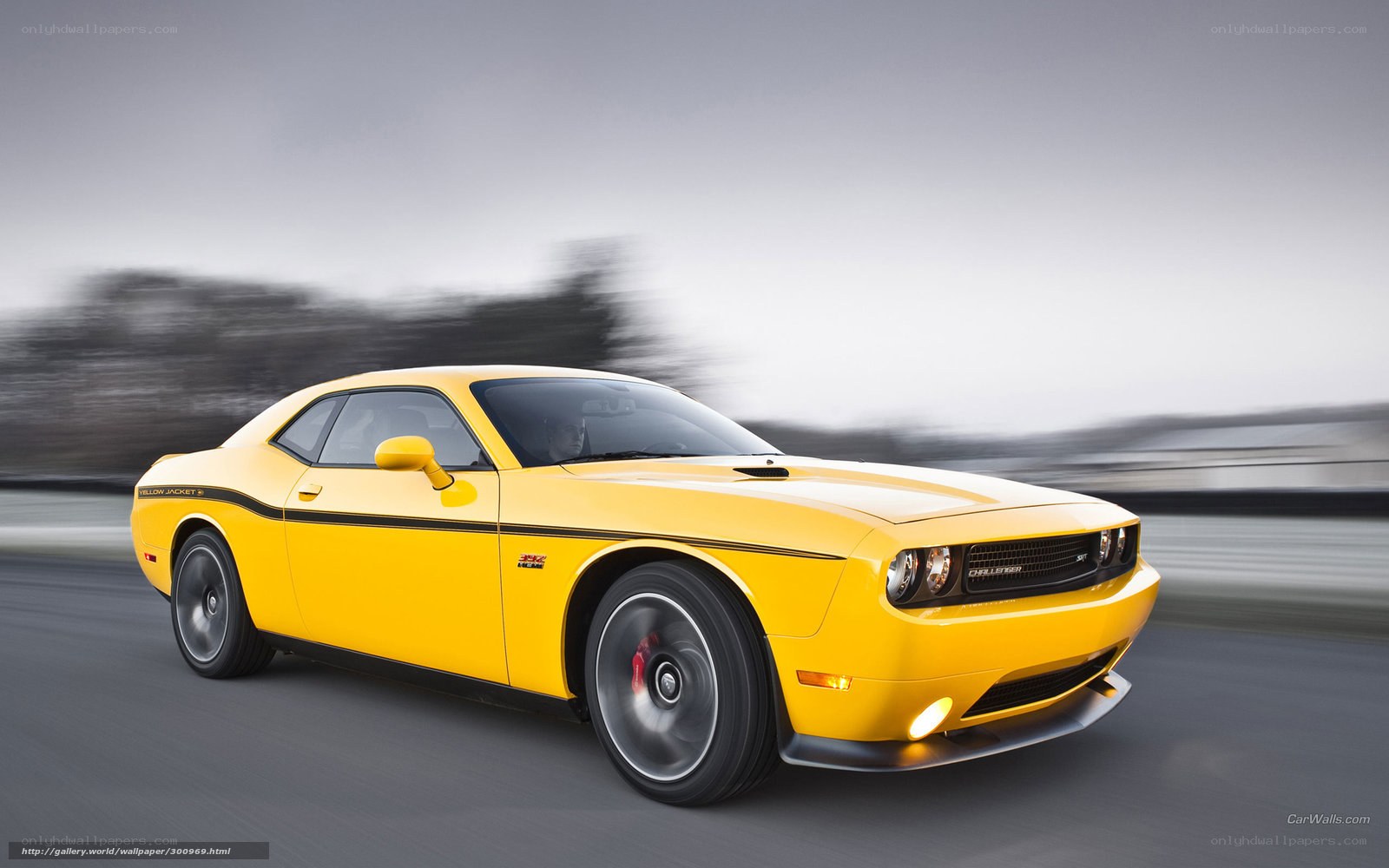 Yellow Dodge Challenger in motion