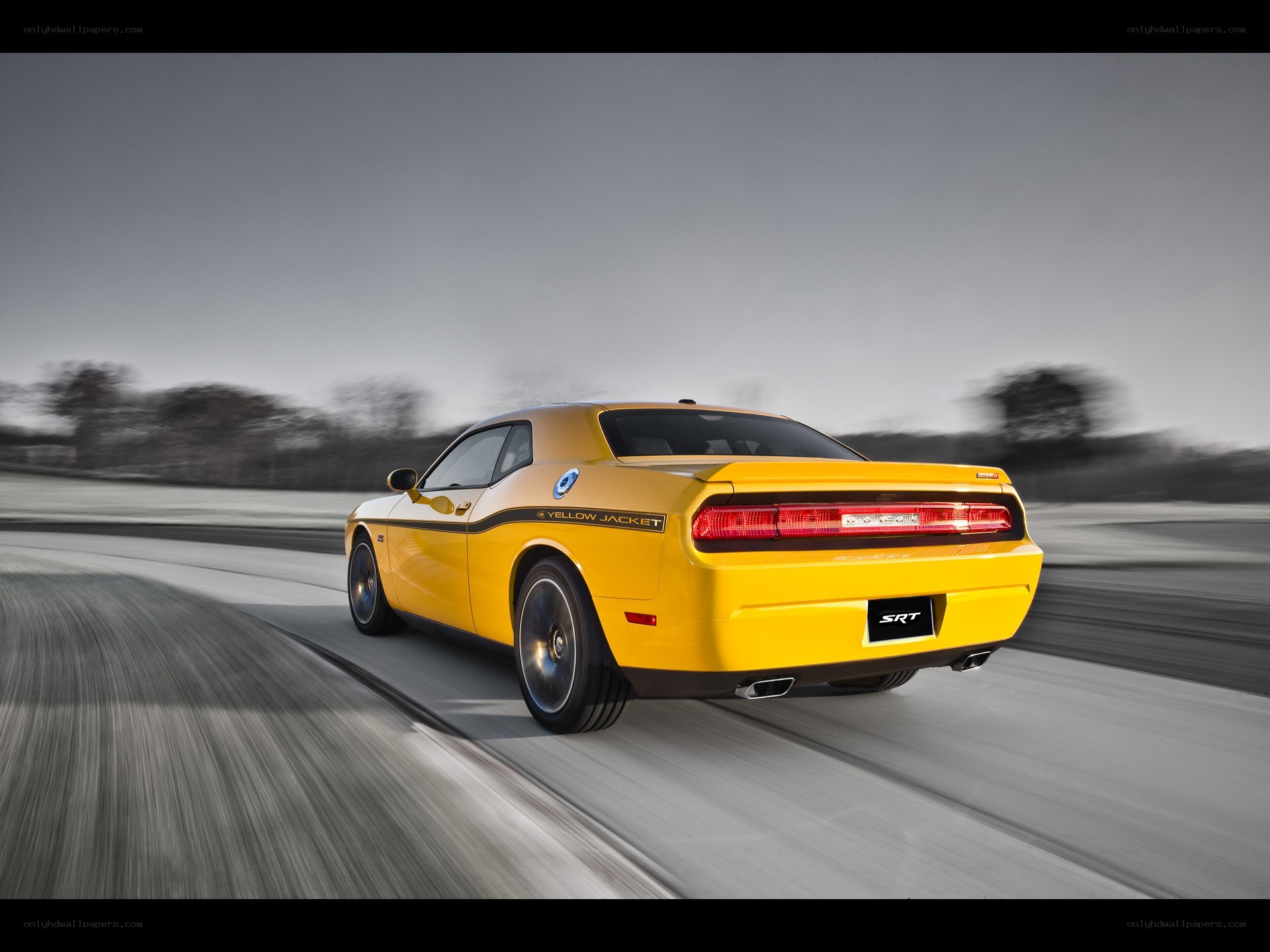 Yellow Dodge Challenger SRT in motion