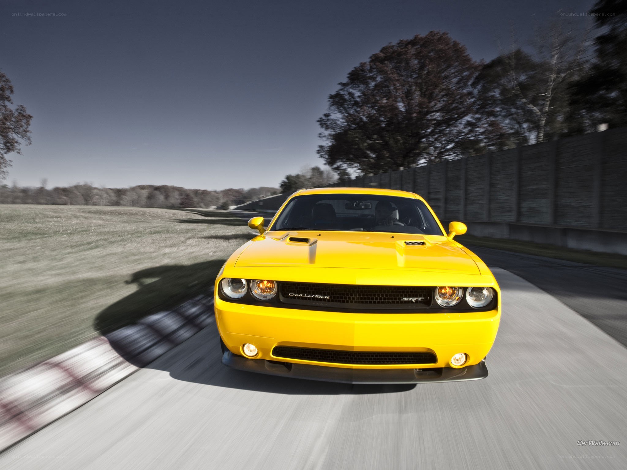 Yellow Dodge Challenger SRT in motion
