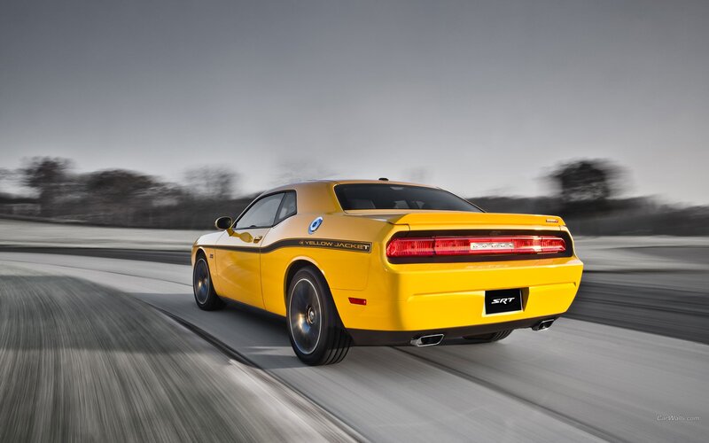 Yellow Dodge Challenger SRT in motion