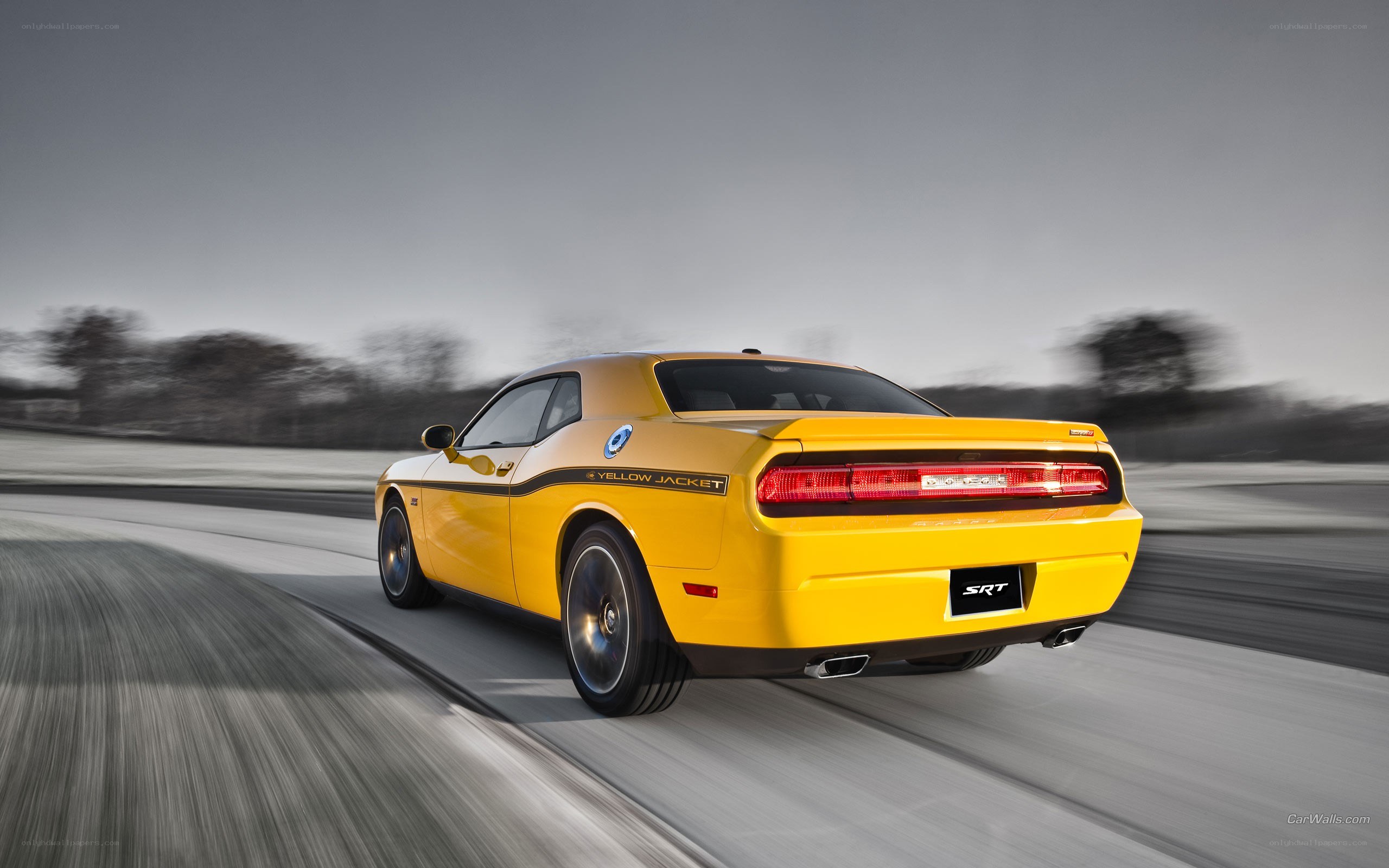 Yellow Dodge Challenger SRT in motion