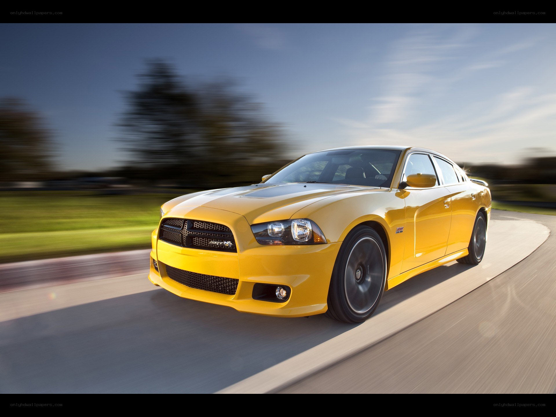 Yellow Dodge Charger in motion
