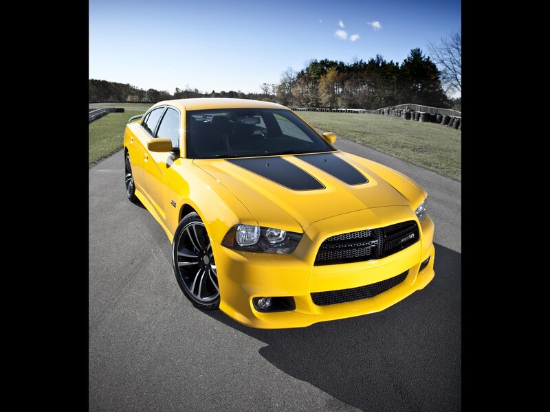 Yellow Dodge Charger on a racetrack