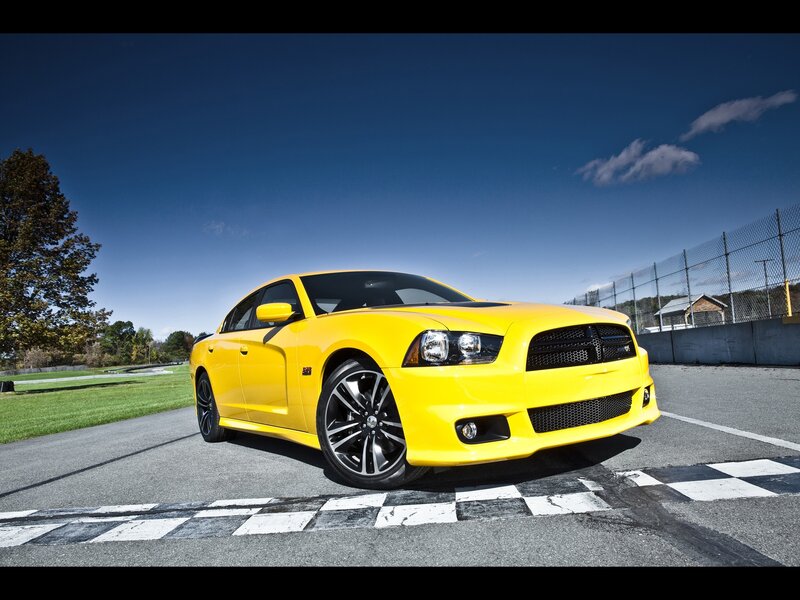 Yellow Dodge Charger on racetrack