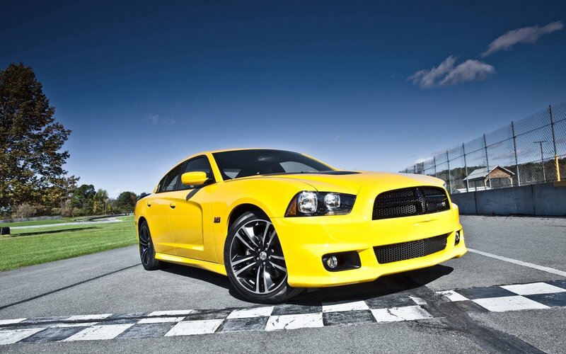 Yellow Dodge Charger on racetrack