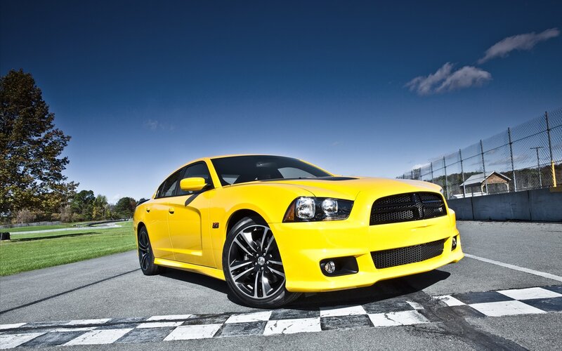 Yellow Dodge Charger on racetrack