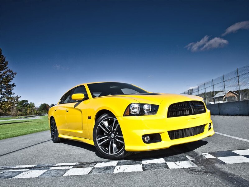 yellow dodge charger on racetrack