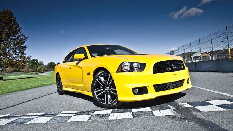 yellow dodge charger on racetrack