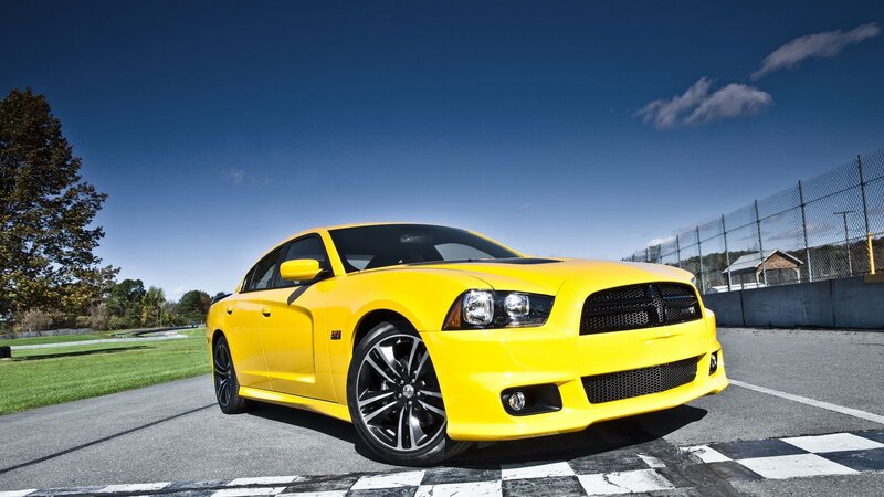 Yellow Dodge Charger on racetrack
