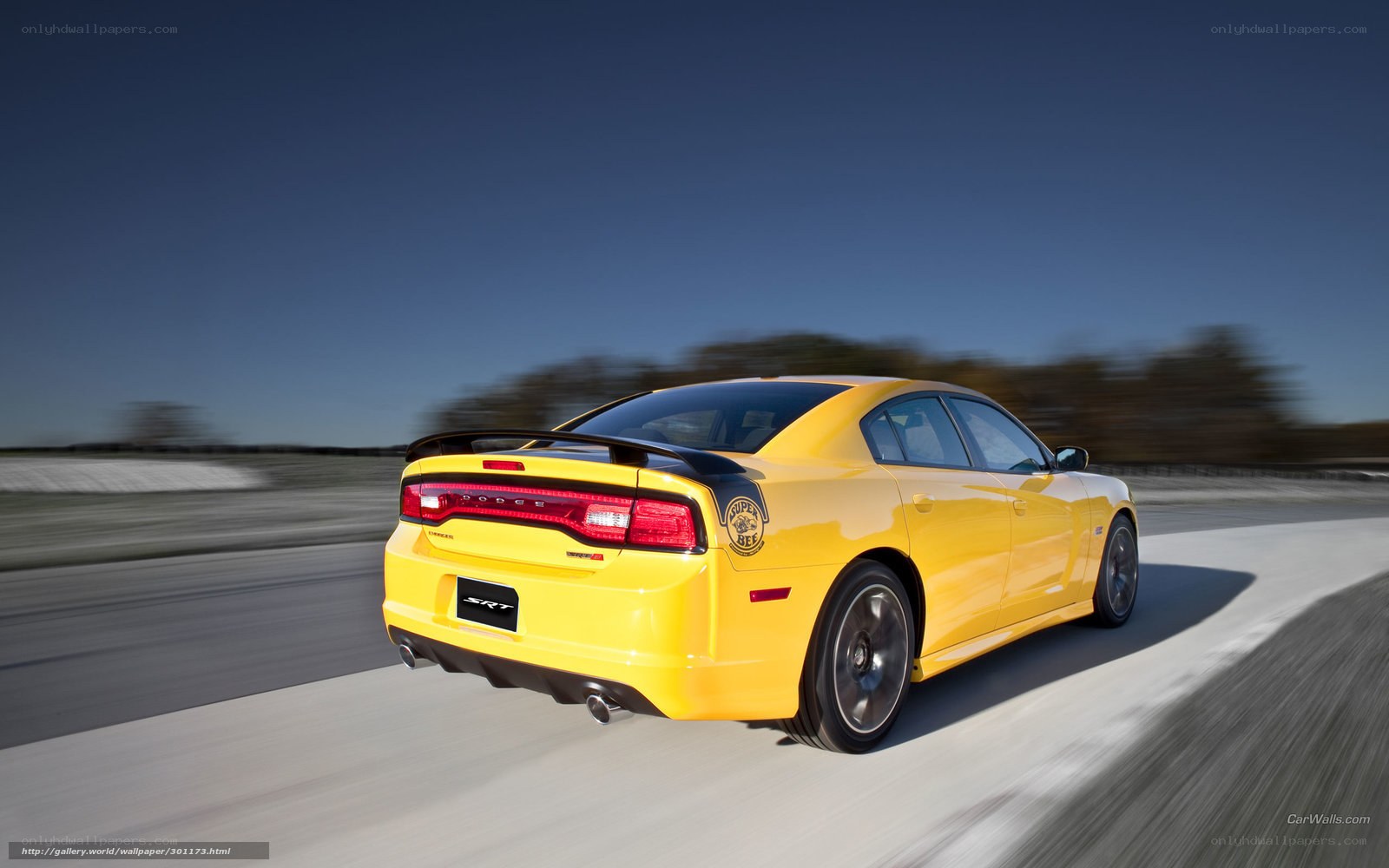 yellow dodge charger srt in motion