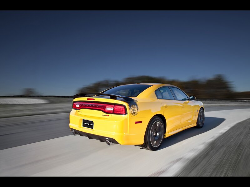 yellow dodge charger srt8 in motion