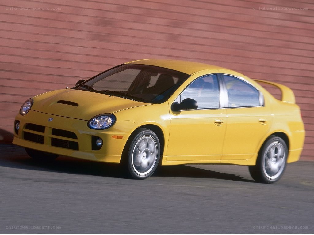 yellow dodge neon srt-4 in motion