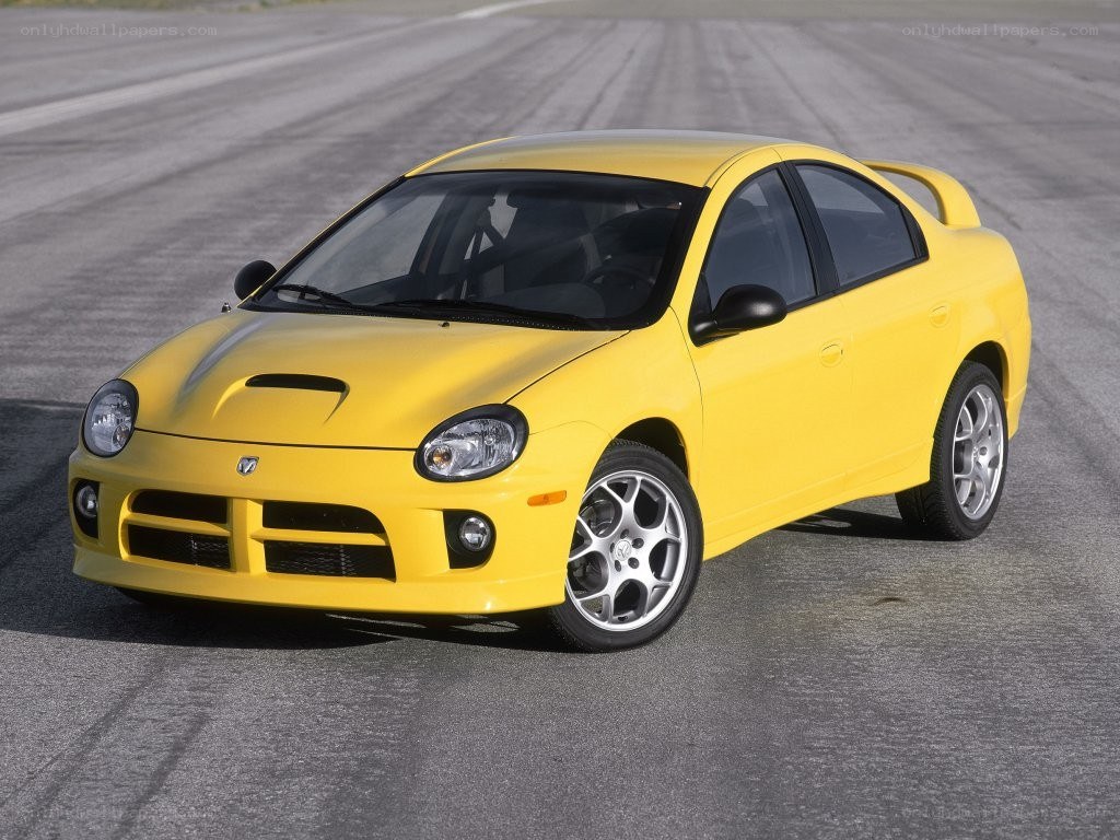 yellow dodge neon srt-4 on track