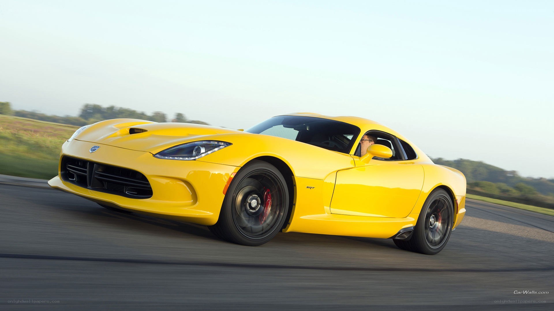 yellow dodge viper in motion