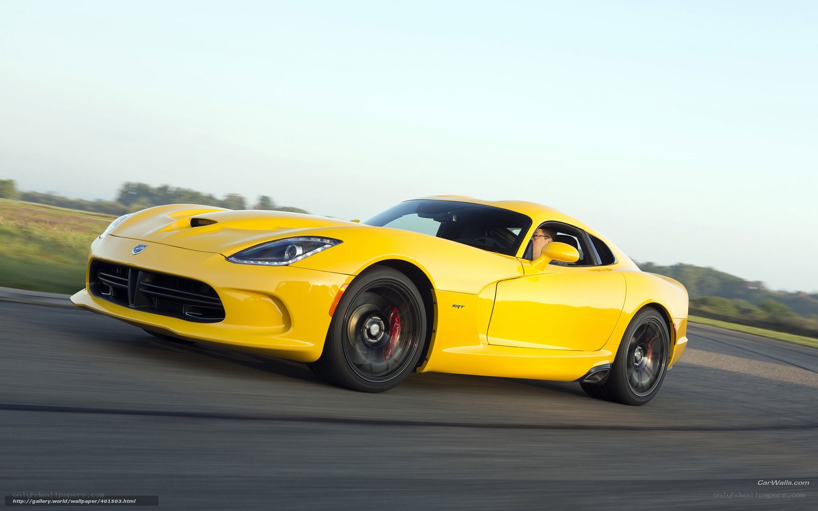 Yellow Dodge Viper in motion