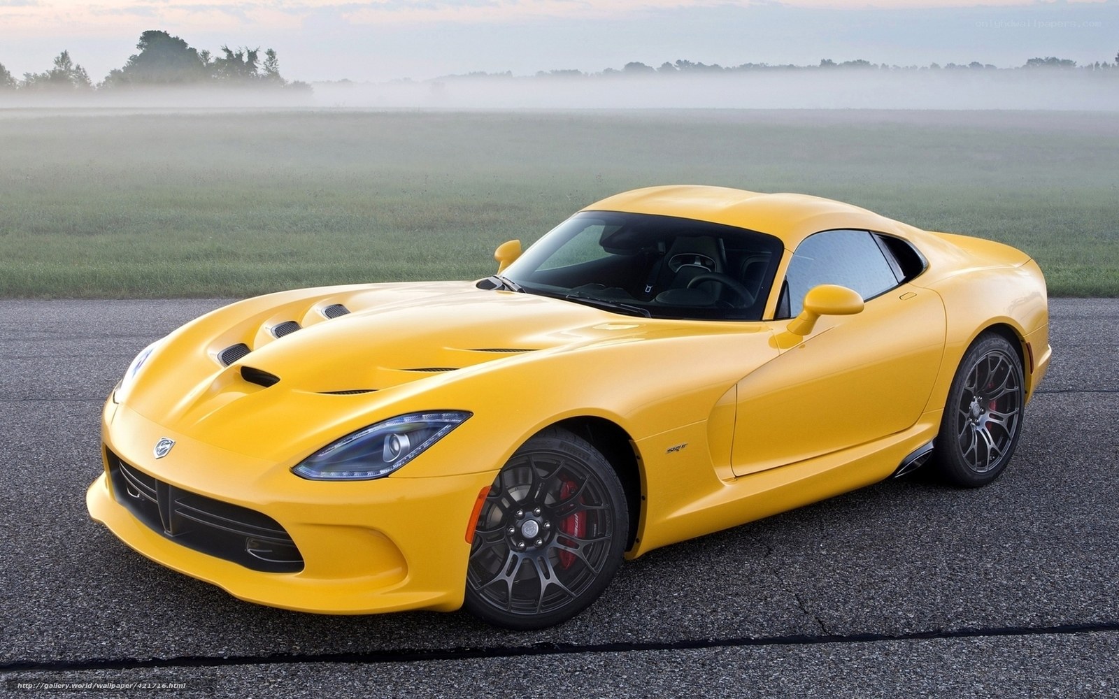 Yellow Dodge Viper on a road