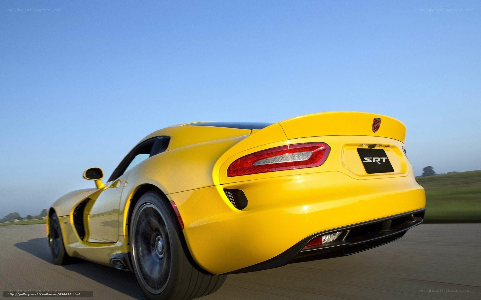 Yellow Dodge Viper SRT in motion