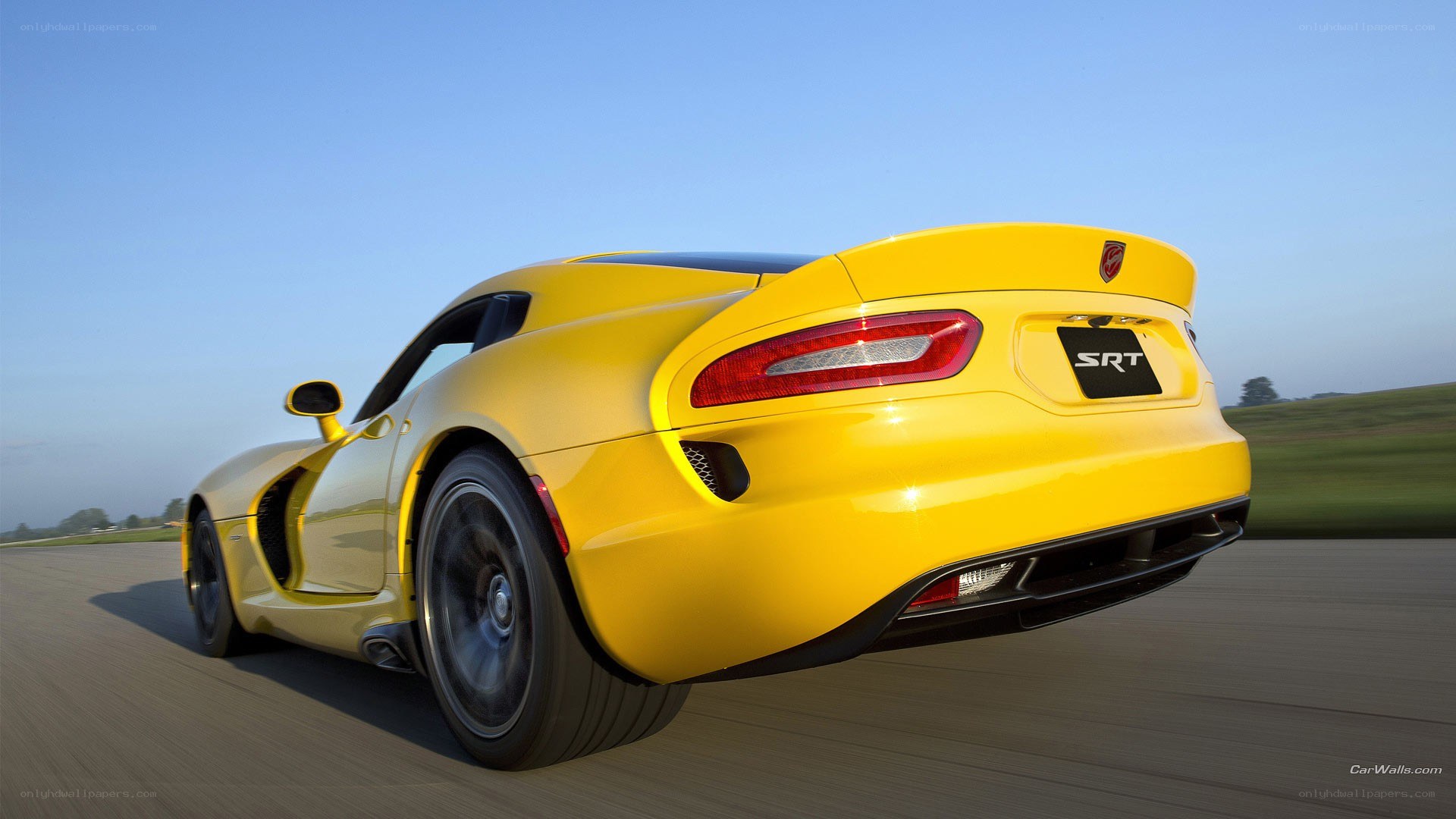 yellow dodge viper srt in motion