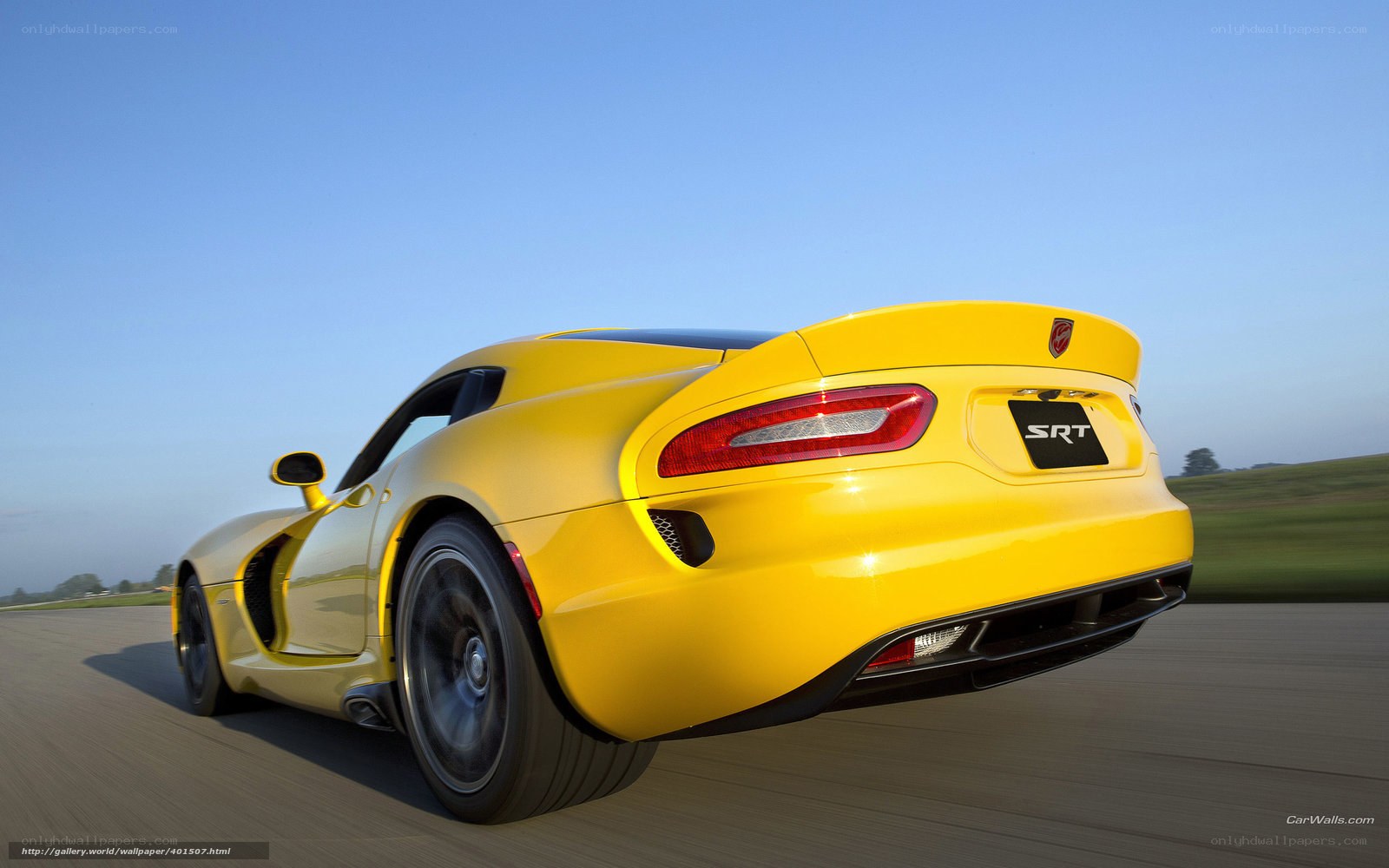 Yellow Dodge Viper SRT in motion