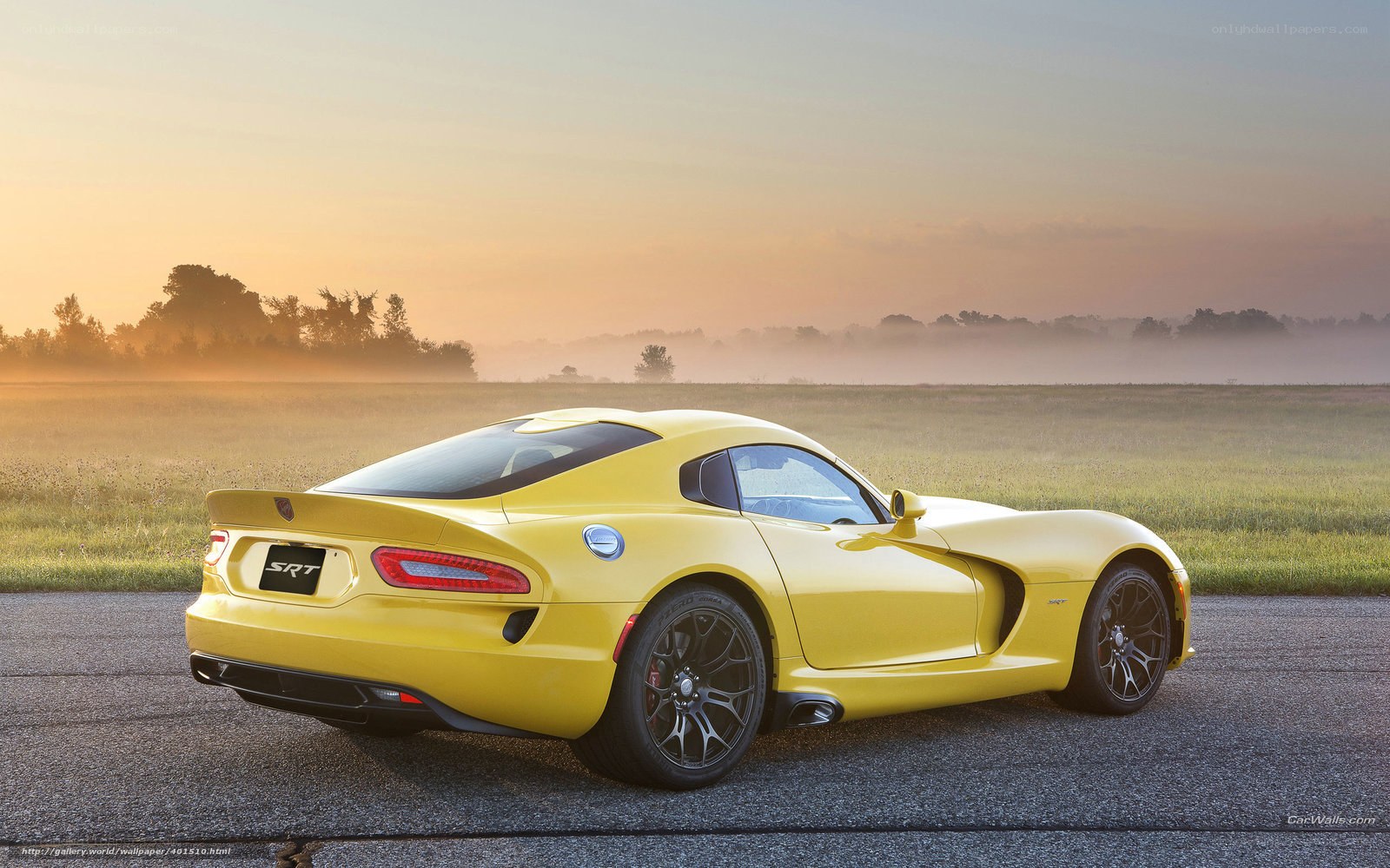 Yellow Dodge Viper SRT on a road