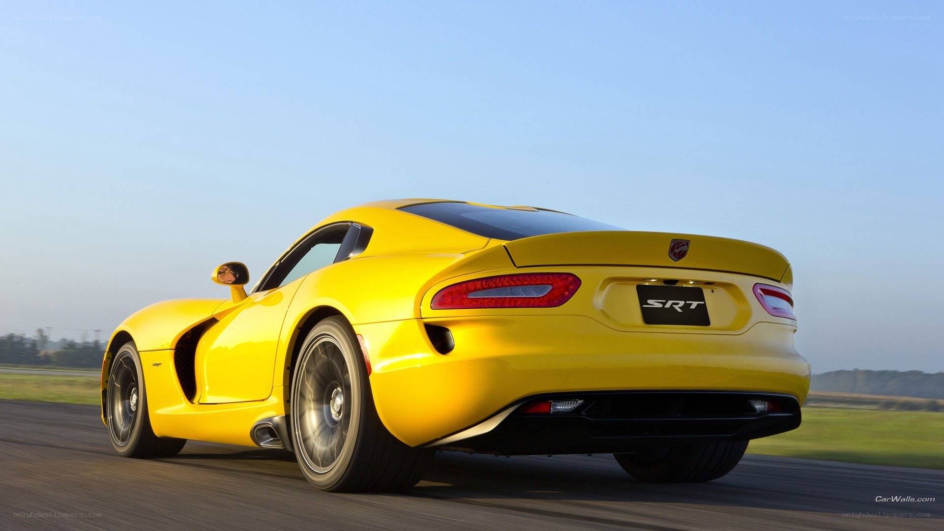 yellow dodge viper srt on track