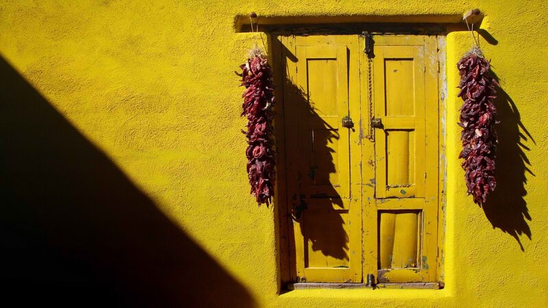Yellow door with chili peppers