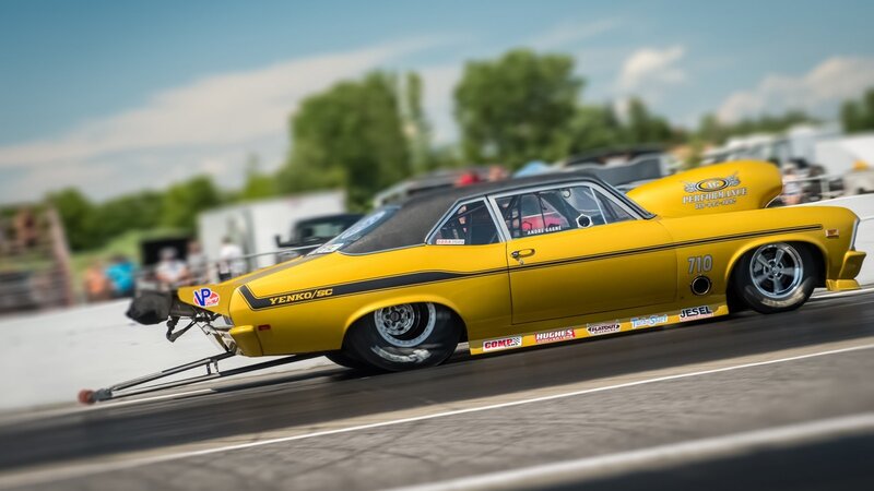 Yellow Drag Racing Car — Dynamic, Afternoon, Photograph, Race Track, Trees