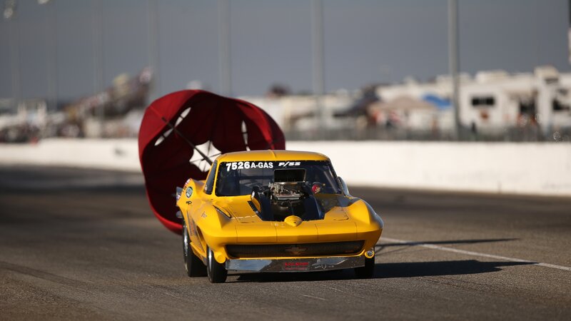 Yellow Drag Racing Car — Dynamic, Afternoon, Photograph, Red Parachute
