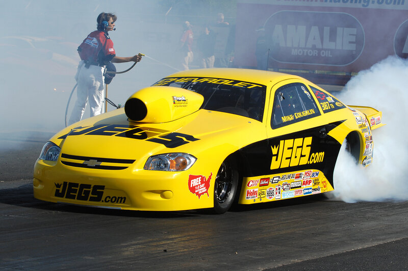 Yellow drag racing car on track
